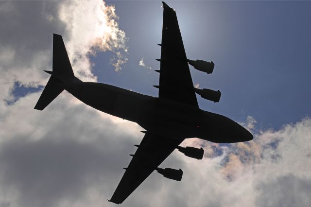 Boeing Globemaster III (97-0041) - A silhouette shot of a Boeing C-17 Globemaster III flew down the coastline over Ocean Isle Beach, NC as part of Salute from the Shore. TURTLE4, (97-0041) from Joint-Base Charleston and a pair of F-16’s from Shaw AFB flew low over the North & South Carolina coastline yesterday afternoon. 