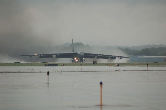 — — - USAF B-52H Blasts off with black smoke and water billowing out from RWY 25 KRFD. A/C is from Minot AFB, heading home