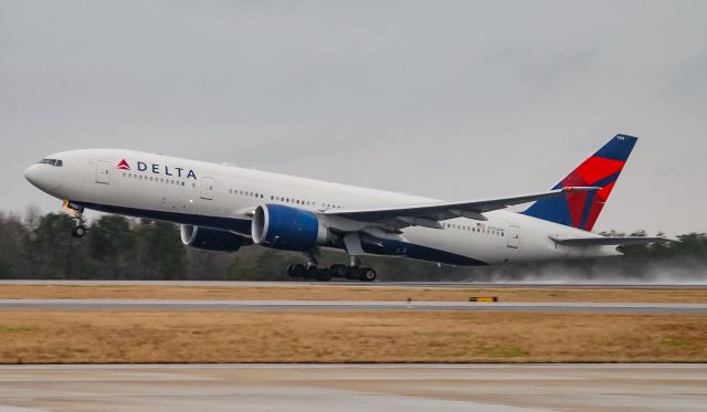 Boeing 777-200 (N703DN) - Departing with a Clemson Football Charter.  Taken 12/23/18.  This plane will be sorely missed when retired.