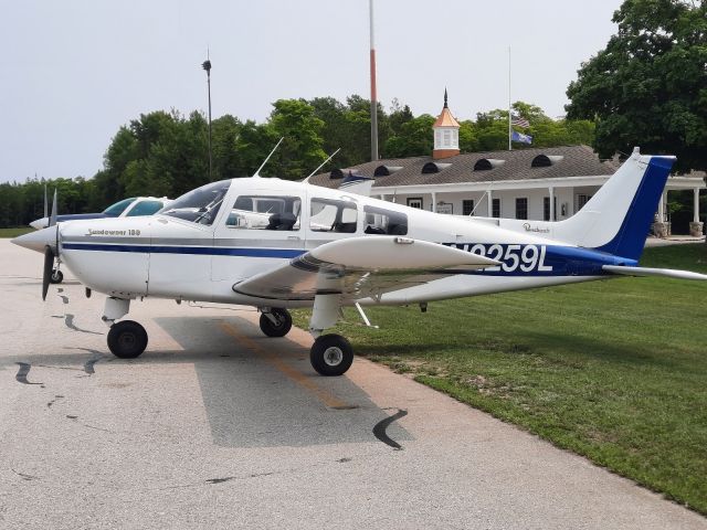 Beechcraft Sundowner (N2259L) - Taking a photo of our plane at Mackinac Island while it's parked after we landed.