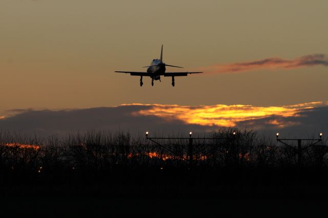 — — - Red Arrows Hawk landing into the sunset after a training practice for the 2015 Display Season