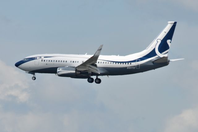 Boeing 737-700 (N101TD) - On final for 23-R 09-01-22. Shot from the opposite side of the airport. Surprised it came out as well as it did. Fully zoomed out and cropped down quite a bit.