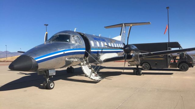 Embraer EMB-120 Brasilia (N257AS) - Offloading cargo from N257AS