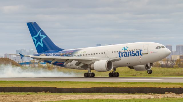 Airbus A310 (C-GTSW) - Smokey touchdown for this Air Transat A310 just in from Glasgow Intl