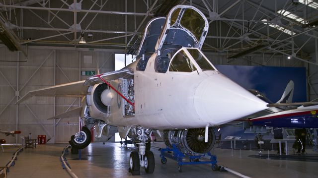 XR220 — - BAC TSR2 Type 571 XR220 at RAF Cosford Museum - 14th July 2015.br /By September 1964, XR220 had been completed and was delivered to Boscombe Down. Unfortunately mishandling of the trailer she was delivered on resulted in the fuselage falling off the trailer and the damage sustained took until February 1965 to be repaired. She was ready to be flown on the day the programme was cancelled, but never did so, and instead remained at Boscombe to be used for noise trials as part of the Concorde programme. She was earmarked for preservation in early 1967, and transported to RAF Henlow in June of that year. Stored for some years, she was dismantled once again and moved to Cosford in 1975 to take her place in the then-new Aerospace Museum.  