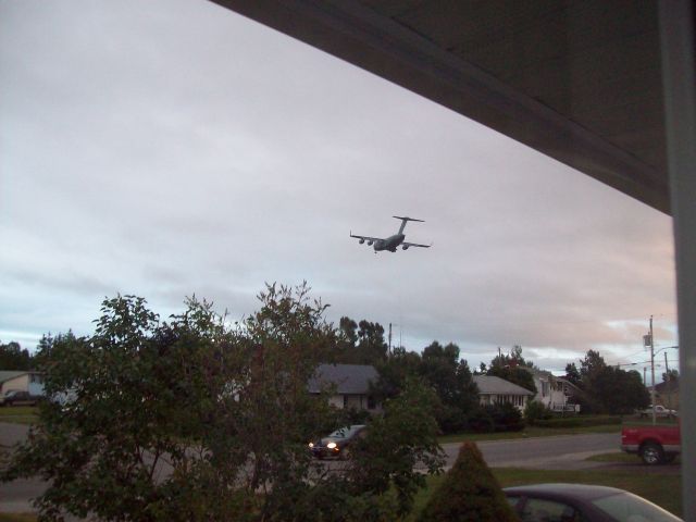 Boeing Globemaster III — - C-17 Globemaster flying over the town of Gander