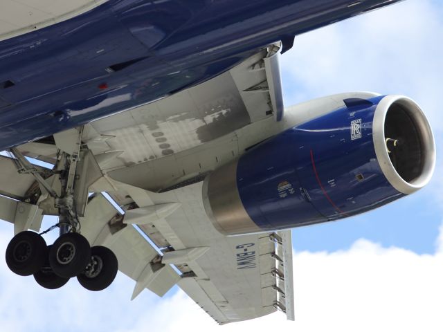 — — - Close up detail of a B767-300ER wing, engine and landing gear.
