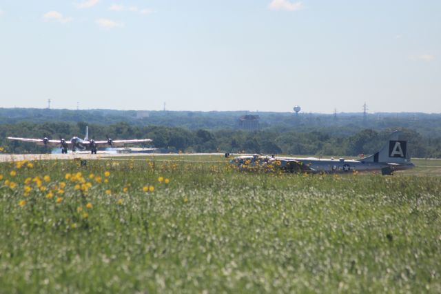 Boeing B-29 Superfortress (N69972) - Doc landing as Fifi watches & waits.br /br /Not the best pic but a glimpse of the only two operational Superfortresses in the world flying at Appleton International on July 27.