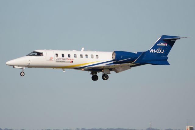 Learjet 45 (VH-CXJ) - On short finals for runway 05. Wednesday, 21st May 2014.