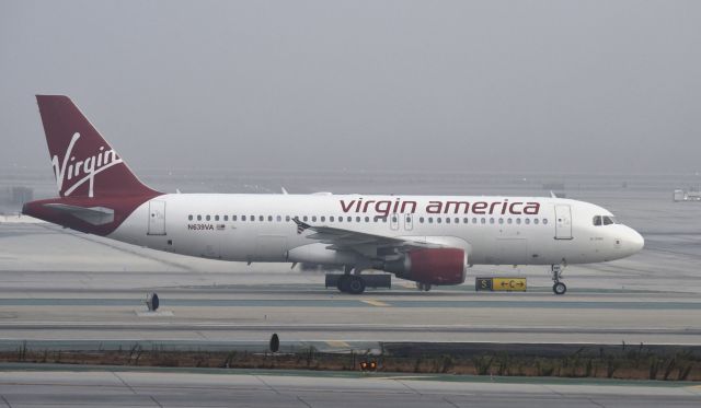 Airbus A320 (N639VA) - Taxiing to gate at LAX on a foggy morning