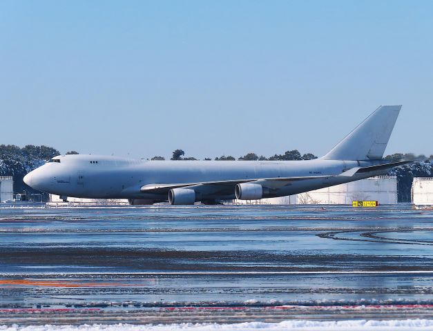 Boeing 747-400 (N404KZ) - Photo taken on Jan 07, 2022.br /Narita International Airport received its first snowfall on January 6, 2022. This is N404KZ being towed through the frozen airport after a long night.br /This photo shows N404KZ arriving as 5Y7105/05 with a delay of 2 hours and 53 minutes on the morning of the 6th, and being towed to the next flight after the stay.