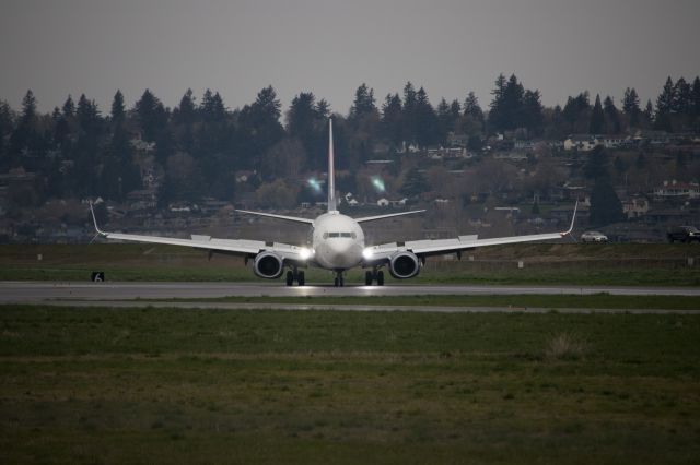 Boeing 737-900 (N846DN) - Flight 887 from KATL to KPDX, turning off runway 10L at exit point A3.