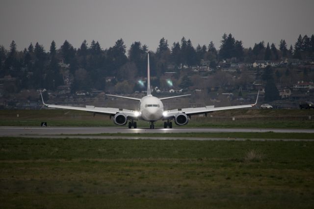 Boeing 737-900 (N846DN) - Flight 887 from KATL to KPDX, turning off runway 10L at exit point A3.