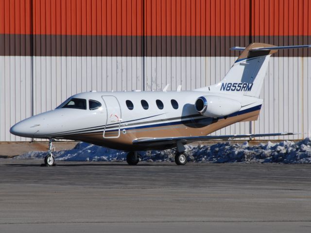 Beechcraft Premier 1 (N855RM) - Beech Premier 1A N855RM visiting Torontos Pearson Airport on Jan 22/10 parked on the Skycharter Apron.