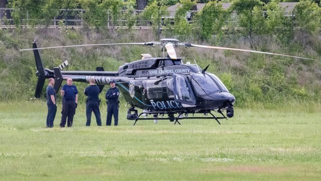 Bell 407 (N911AP) - N411AP parked on the grass at College Park Airport 