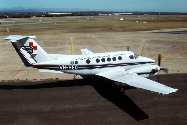 Robinson R-22 (VH-HEO) - ROYAL FLYING DOCTOR SERVICE OF AUSTRALIA - BEECH 200C SUPER KING AIR - REG : VH-HEO (CN BL/41) - PARAFIELD ADELAIDE SA. AUSTRALIA - YPPF 35MM SLIDE CONVERSION.