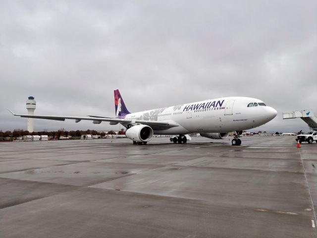 Airbus A330-200 (N380HA) - In CLT with the new ATC tower behind after a repaint in FCO and brought the Seahawks down to CLT for the game tomorrow.br /Seahawks won 30-27br /br /11/24/18