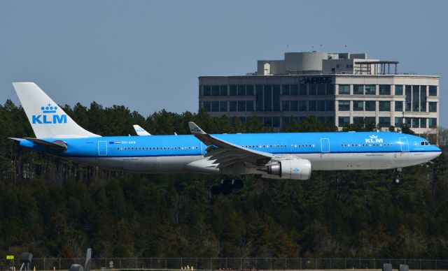 Airbus A330-300 (PH-AKB) - Landing on RWY 19L & Airbus building in the background