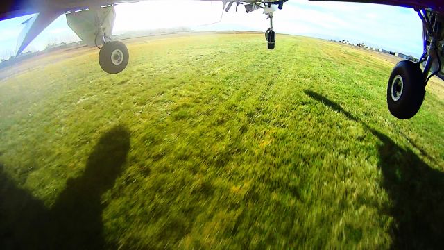 Beechcraft Bonanza (33) (N8943U) - Beech Debonair landing on the grass at Frazier Lake Airport, CA, 1C9 near Hollister...Nice!!