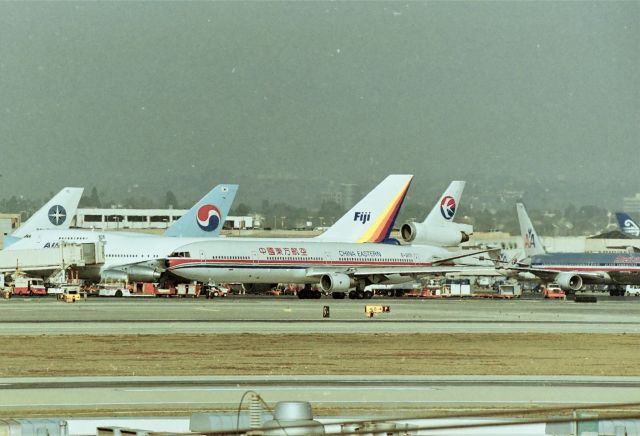 Boeing MD-11 (B-2171) - KLAX - Jan 1998 - 4 day weekend run w Mark & Mike Durbin and co worker/ part time AA employee Craig Curtis we hit every spotters vantage point we could. This is Imperial Hill. I only had a 60-300mm lens so this was all I could get....but, Imperial Parking lot was the best. I'll hafta find some pics from there to post - that i haven't already posted here.