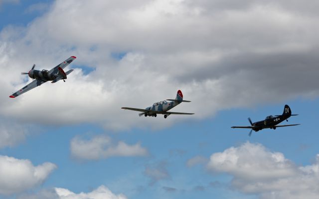 YAKOVLEV Yak-50 (N613BM) - Yak 50s and a Yak 52 in formation at the San Martin Airport.