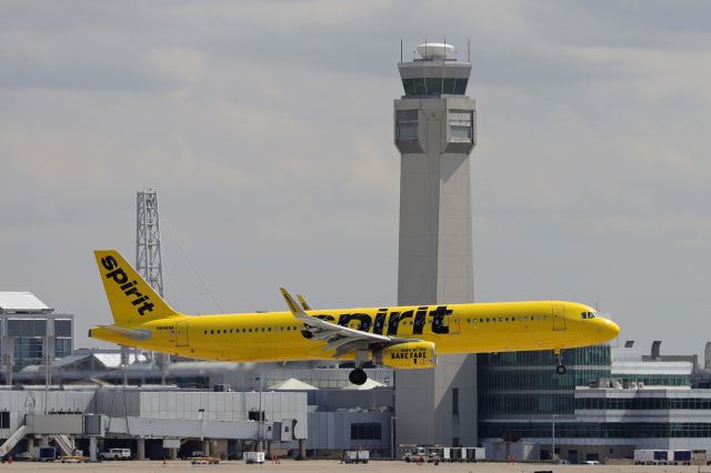 Airbus A321 (N668NK) - NKS1913, a Spirit Airlines A321, passing by the old tower on approach for RWY 24L this afternoon, 31 Mar 2021.