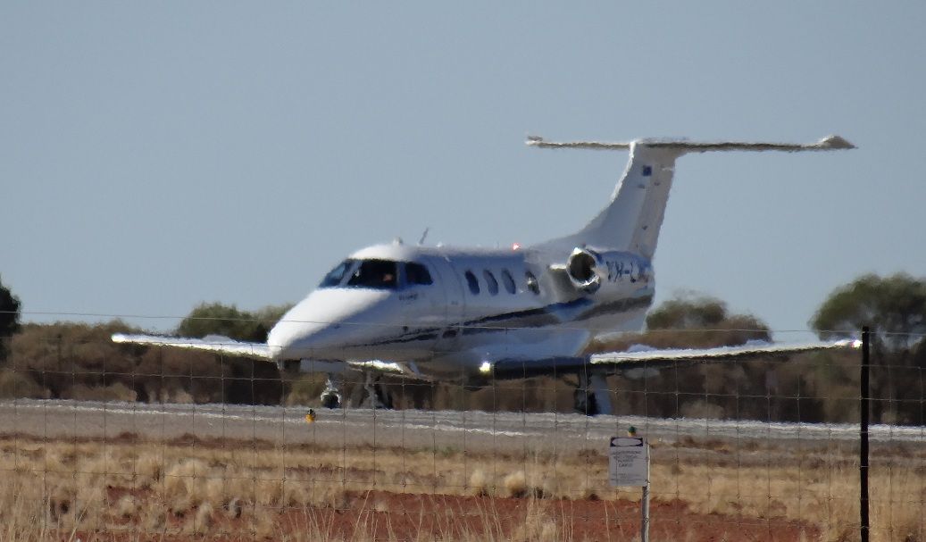 Embraer Phenom 100 (VH-LWZ) - Mirage shimmer at the threshold