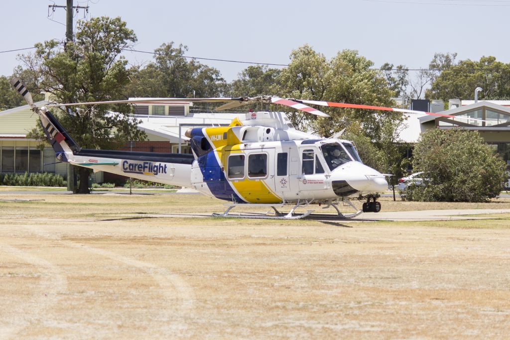 Bell 412 (VH-LWI) - CareFlight (VH-LWI) Bell 412EP at the Duke of Kent Oval (YXWG) helipad.