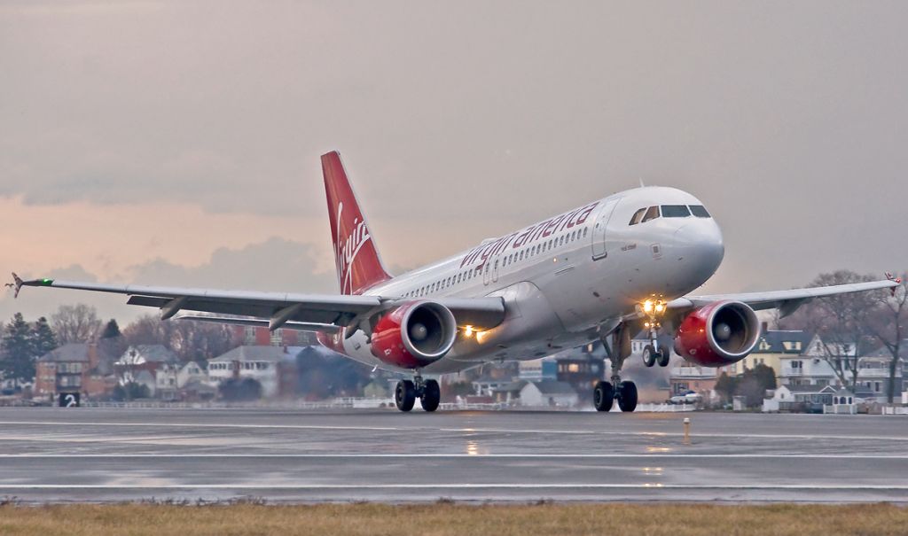 Airbus A320 (N842VA) - Virgin America A320 sunset landing RWL22L 