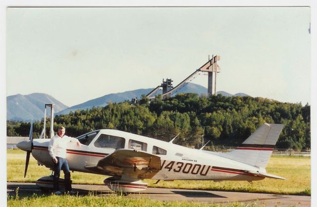 Piper Cherokee (N4300U) - Dennis Ryan with Piper Archer N4300U at Lake Placid, NY, 1986.br /Olympic Ski Jumps and the 1980 Olympic Torch in background.