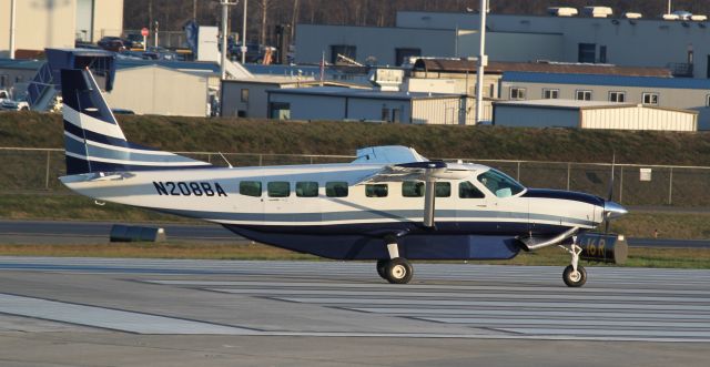 Cessna Caravan (N208BA) - Boeings Cessna 208B Caravan taxiing onto RWY 16R at Paine Field after the 747-8 successful first flight.