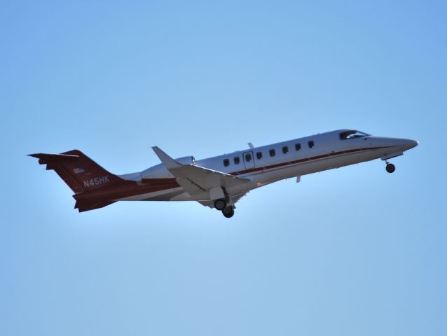 Learjet 45 (N45HK) - JOHN Q HAMMONS departing runway 20 at KJQF - 1/23/13