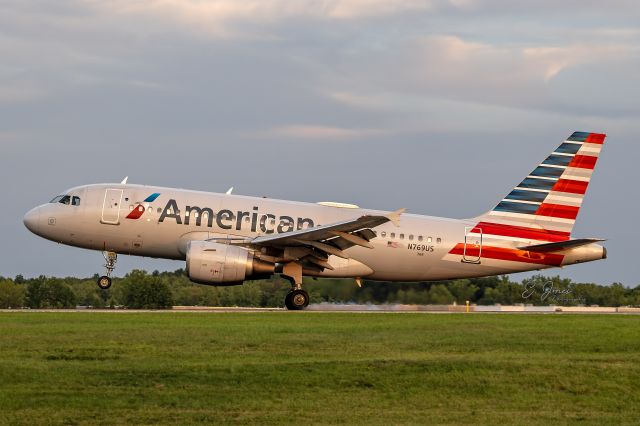 Airbus A319 (N769US) - AAL1813  touching down on RWY 6L on 23 Aug 2024 from Philadelphia Intl – KPHL during a partly cloudy golden hour.
