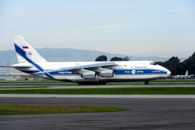 Antonov An-12 (RA-82045) - P-2V Neptune in the background