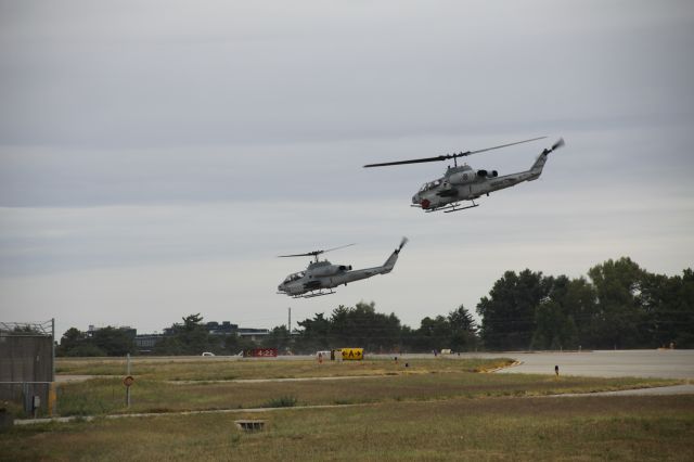 — — - USMC HMA 269ths "Lawman 6" and his "partner" departing KLEX. (Bell AH-1 SuperCobras.)
