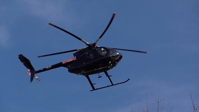 MD Helicopters MD 500 (N765KV) - Checking power lines in the area.