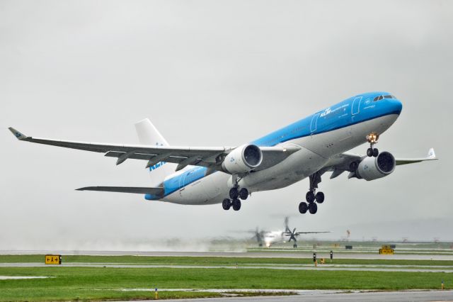 Airbus A330-200 (PH-AOA) - Rainy day for some spray and condensation