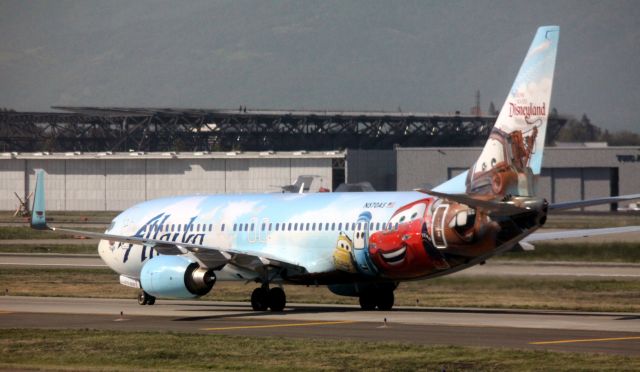 Boeing 737-700 (N570AS) - Taxiing to gate after landing 30L .. DISNEY CARS THEME plane