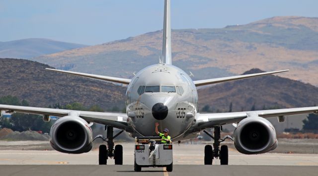 Boeing P-8 Poseidon (16-9335) - One of the seven US Navy big birds to make brief stops in Reno yesterday was this P-8A Poseidon (169335) seen here being led by an Atlantic ramp agent from taxiway Charlie to its parking position next to a Navy C-40 on the Atlantic Aviation ramp.  A Navy KC-130 followed this P-8A on to the Atlantic ramp.