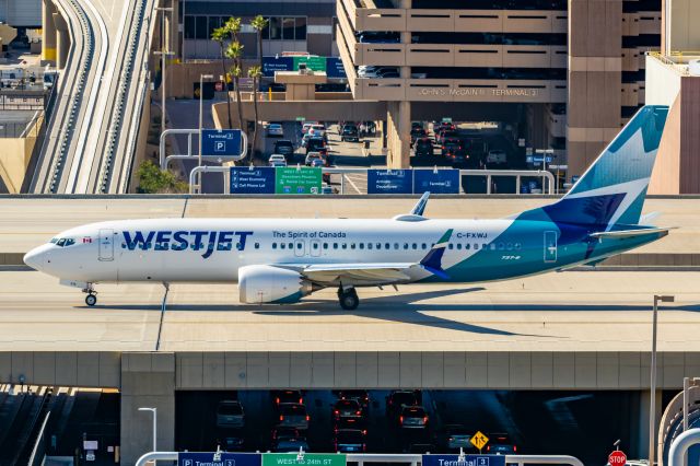 Boeing 737 MAX 8 (C-FXWJ) - A WestJet 737 MAX 8 taxiing at PHX on 2/9/23 during the Super Bowl rush. Taken with a Canon R7 and Tamron 70-200 G2 lens.