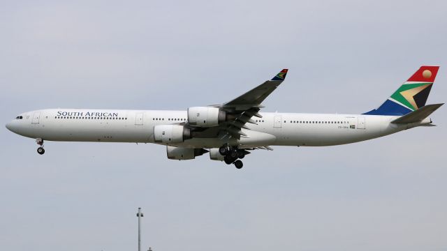 Airbus A340-600 (ZS-SNA) - Operating as South African 1, carrying a SA government delegation that attended sideline discussions at the G7. Not sure why their flight stopped at YYZ on the way to and from YQB, but Im glad they did. If only the weather cooperated too...