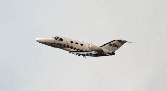 Cessna Citation Mustang (N323PG) - Departing cross wind from 27 at Carson City