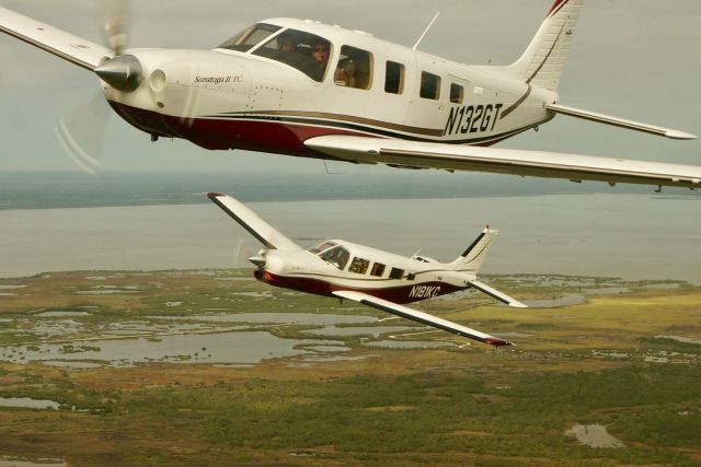 Piper Saratoga/Lance (N132GT) - N132GT & N181KC in formation during a FAST formation clinic over NASA Space Center KTSS