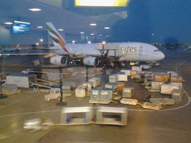 Airbus A380-800 — - A plane being serviced in the distance.