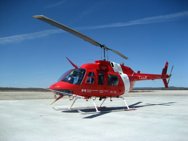 Bell JetRanger (C-GCHM) - Canadian Coast Guards Bell 206 Longranger parked in Némiscau (CYHH), Québec - May 2011.