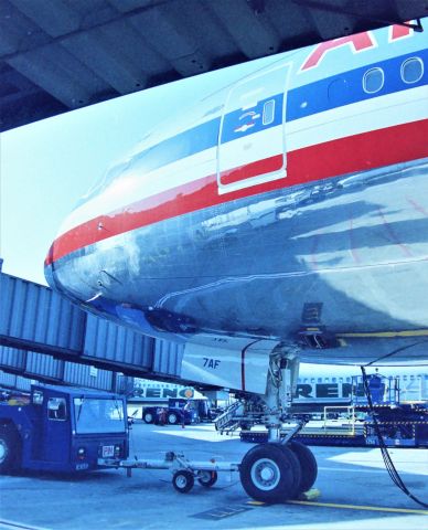 Boeing 777-200 (N775AN) - KSJC - Inaugural American Airlines 777-200 service San Jose, CA USA to Tokyo-Narita, (SJC-NRT) Japan on May 1, 1999. I was able to get Aircraft and ramp access for photos and videos of the departure with the help of a co-worker. This jet was less than 1-month old, and a side note I saw this jet at Boeing Everett in April 1999 undergoing flight test and also parked on the hard stand - just by chance when up visiting my Father and other relatives that year. Special thanks to Craig Curtis for the help with Ramp access and jet tour. In this photo, we were able to hang around below the aircraft for about 1/2 and hour chatting with the ramp crews and Craig's former co-worker. Believe it or not, I have not seen these photos since I took them, and posting this week 5/22/2020. I had forgotten I caught the 2 Reno Air birds at their gates.