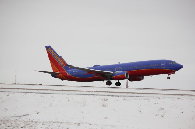 Boeing 737-800 (N8326F) - Taking off from 17R.