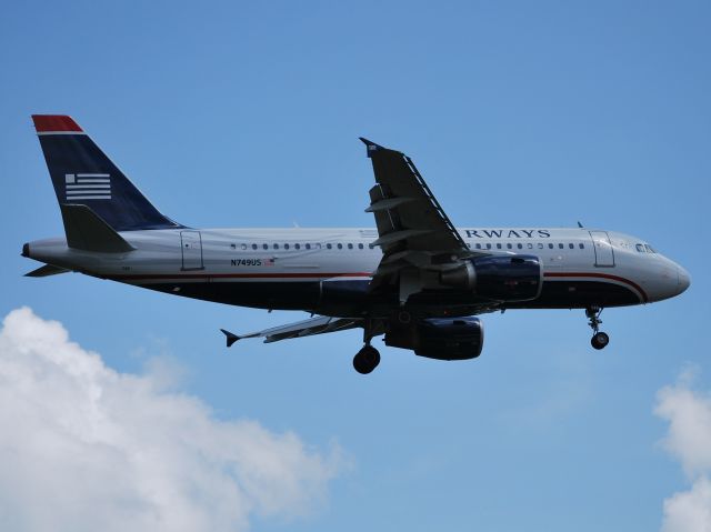 Airbus A319 (N749US) - Final for runway 23 - 3/25/13