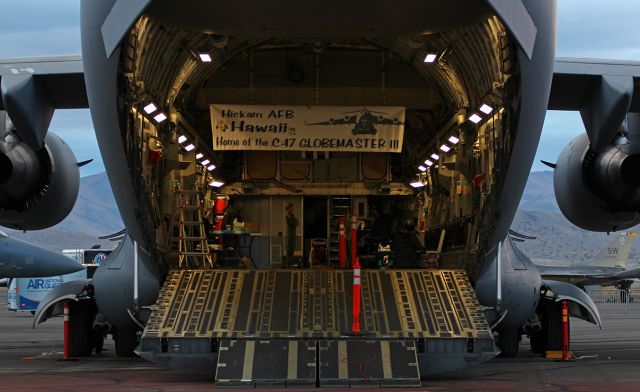 05-5147 — - Having completed the offload, three members of this Hickam-based C-17A (05-5147) take a moment to converse before closing up their Globemaster III for the night.  This C-17 had just arrived at Stead on the evening before the beginning of the 2015 National Championship Air Races and was being prepared for static display throughout the event.br /This is my 501st photo submission to FA.br /This photo is the first pic of 05-5147 to be posted into the FA gallery.