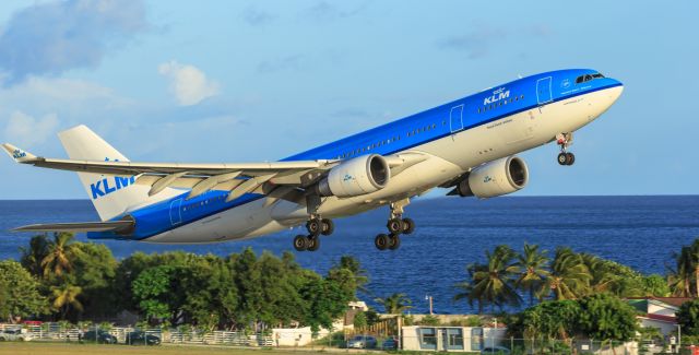 Airbus A330-200 (PH-AOF) - Its up and away for the KLM registration PH-AOF at TNCM St Maarten on 13-08-2017 to schiphol Amsterdam in the Netherlands. 